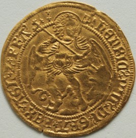 HAMMERED GOLD 1509 -1526 HENRY VIII ANGEL. 1ST COINAGE.THE ARCHANGEL MICHAEL SLAYING THE DRAGON. REVERSE. SHIP BEARING SHIELD. CROSS ABOVE BISECTING H AND ROSE. MM CASTLE. FULL FLAN GVF