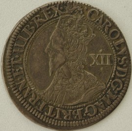 CHARLES I 1643 -1644 CHARLES I SHILLING. YORK MINT. GR.2. CROWNED BUST LEFT. XII BEHIND. REV. CROWNED AND GARNISHED OVAL SHIELD. EBOR BELOW. MM LION 3. GVF