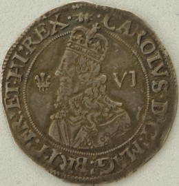 CHARLES I 1643  CHARLES I SIXPENCE. OXFORD MINT. STRUCK FROM AN ABERYSTWYTH OBV. DIE. CROWNED BUST LEFT. PLUME BEFORE AND MARK OF VALUE BEHIND. REV. DECLARATION IN THREE LINES. THREE OXFORD PLUMES ABOVE. MM BOOK. SUPERB PORTRAIT NEF